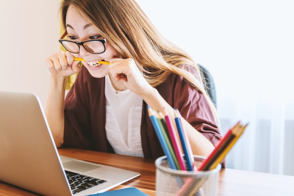 person stressed while looking at their computer